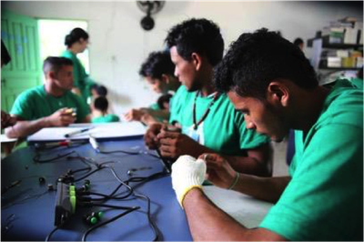 Remote communities in the Amazon region receive solar powered lamps made from recycled bottles